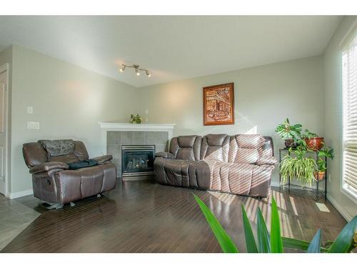 10225 85B Street, Grande Prairie, AB - Indoor Photo Showing Living Room With Fireplace