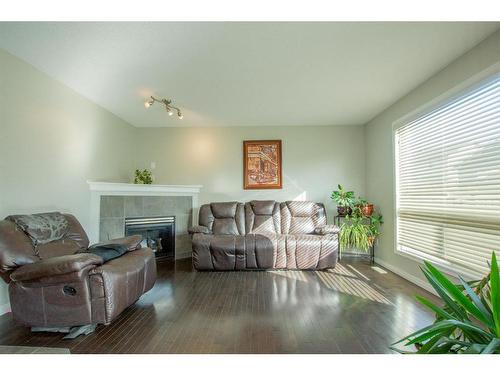 10225 85B Street, Grande Prairie, AB - Indoor Photo Showing Living Room With Fireplace