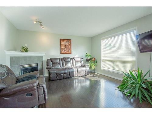 10225 85B Street, Grande Prairie, AB - Indoor Photo Showing Living Room With Fireplace