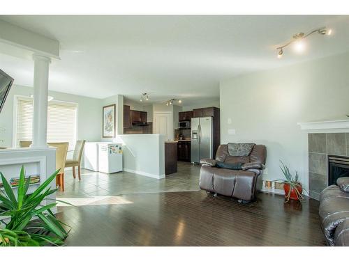 10225 85B Street, Grande Prairie, AB - Indoor Photo Showing Living Room With Fireplace