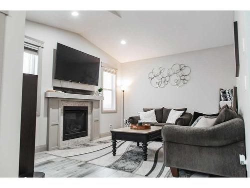 8685 122 Avenue, Grande Prairie, AB - Indoor Photo Showing Living Room With Fireplace