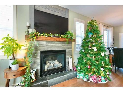 9122 133 Avenue, Peace River, AB - Indoor Photo Showing Living Room With Fireplace