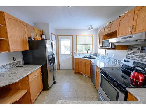 12509 98 Street, Grande Prairie, AB - Indoor Photo Showing Kitchen With Double Sink