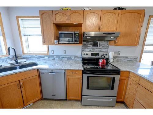 12509 98 Street, Grande Prairie, AB - Indoor Photo Showing Kitchen With Double Sink