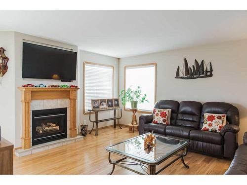 10007 104 Street, Sexsmith, AB - Indoor Photo Showing Living Room With Fireplace