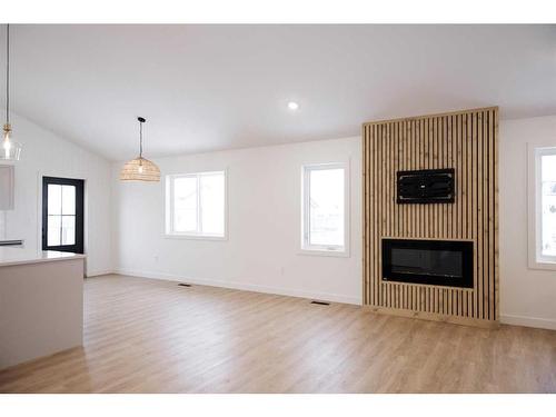 6401 113 Street, Grande Prairie, AB - Indoor Photo Showing Living Room With Fireplace