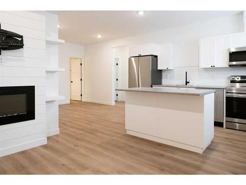 6401 113 Street, Grande Prairie, AB - Indoor Photo Showing Kitchen With Fireplace With Upgraded Kitchen