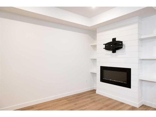 6401 113 Street, Grande Prairie, AB - Indoor Photo Showing Other Room With Fireplace