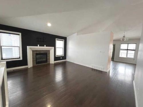 10913 60 Avenue, Grande Prairie, AB - Indoor Photo Showing Living Room With Fireplace