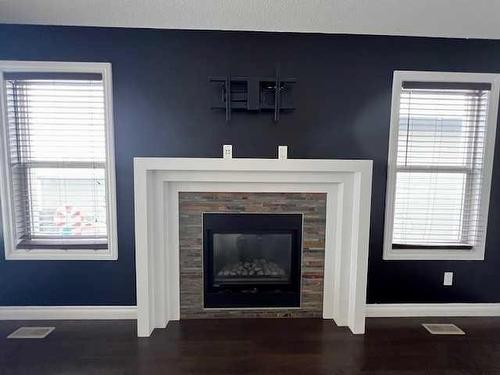 10913 60 Avenue, Grande Prairie, AB - Indoor Photo Showing Living Room With Fireplace