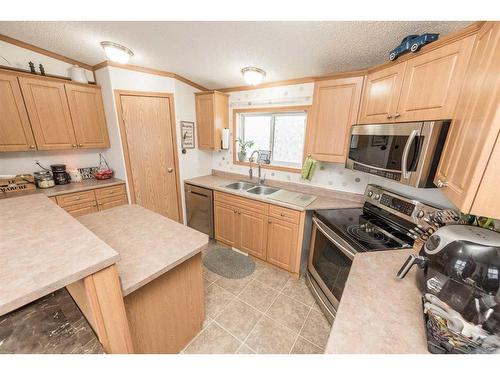 9003 85 Avenue, Grande Prairie, AB - Indoor Photo Showing Kitchen With Double Sink