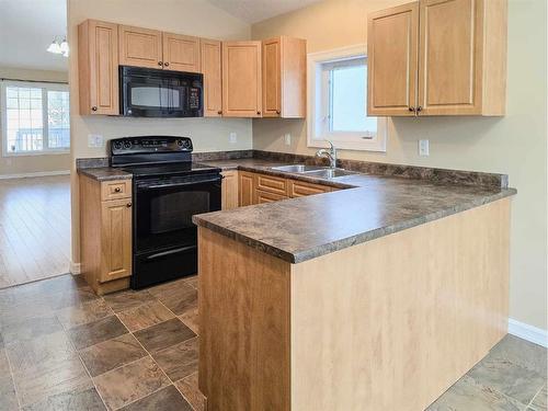 17-131 Moberly Road, Grande Cache, AB - Indoor Photo Showing Kitchen With Double Sink