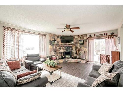 72174 Rr 13, Debolt, AB - Indoor Photo Showing Living Room With Fireplace