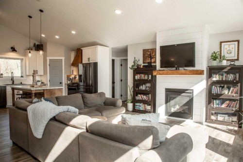 19125 Township Road 1104, Rural Mackenzie County, AB - Indoor Photo Showing Living Room With Fireplace