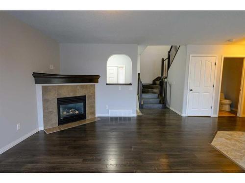 8545 102A Avenue, Grande Prairie, AB - Indoor Photo Showing Living Room With Fireplace