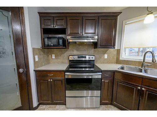 8545 102A Avenue, Grande Prairie, AB - Indoor Photo Showing Kitchen With Double Sink