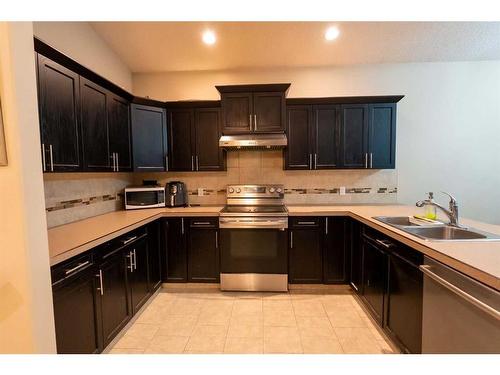 12410 102B Street, Grande Prairie, AB - Indoor Photo Showing Kitchen With Double Sink