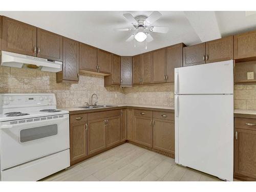 9615 109 Avenue, Grande Prairie, AB - Indoor Photo Showing Kitchen With Double Sink