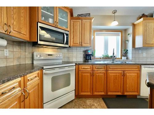 82356 Range Road 214, Rural Northern Sunrise County, AB - Indoor Photo Showing Kitchen With Double Sink