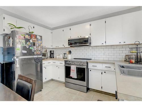 6918 99A Street, Grande Prairie, AB - Indoor Photo Showing Kitchen With Double Sink