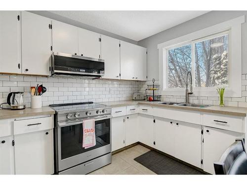 6918 99A Street, Grande Prairie, AB - Indoor Photo Showing Kitchen With Double Sink