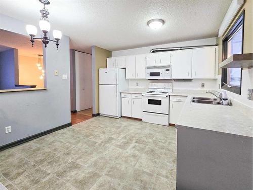 10353 99Th Avenue, Grande Cache, AB - Indoor Photo Showing Kitchen With Double Sink