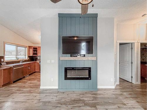 13002 93A Street, Grande Prairie, AB - Indoor Photo Showing Living Room With Fireplace