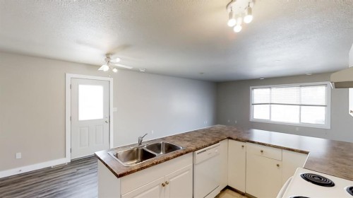 C-10029 105 Avenue, Grande Prairie, AB - Indoor Photo Showing Kitchen With Double Sink