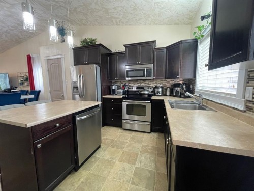 5069 Cornerstone, High Prairie, AB - Indoor Photo Showing Kitchen With Double Sink