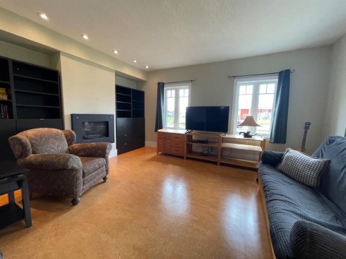 75 Peace River Avenue, Joussard, AB - Indoor Photo Showing Living Room With Fireplace