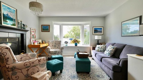 10501 83 Street, Peace River, AB - Indoor Photo Showing Living Room With Fireplace