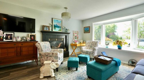 10501 83 Street, Peace River, AB - Indoor Photo Showing Living Room With Fireplace