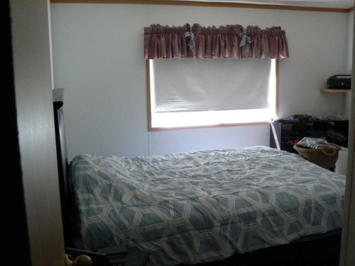 75105 153 Range, High Prairie, AB - Indoor Photo Showing Bedroom