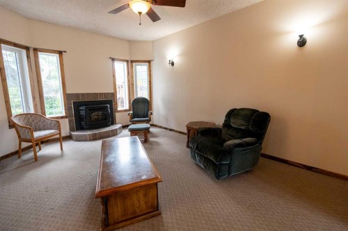 4501 52 Street, Fort Vermilion, AB - Indoor Photo Showing Living Room With Fireplace