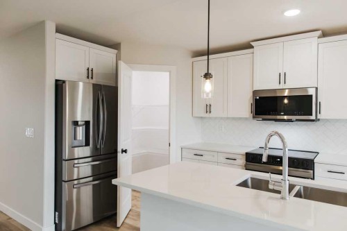 9558 114 Avenue, Clairmont, AB - Indoor Photo Showing Kitchen With Stainless Steel Kitchen With Upgraded Kitchen