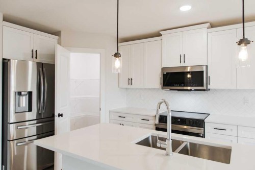 9558 114 Avenue, Clairmont, AB - Indoor Photo Showing Kitchen With Stainless Steel Kitchen With Double Sink With Upgraded Kitchen