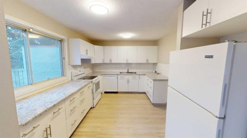 9832 81 Avenue, Grande Prairie, AB - Indoor Photo Showing Kitchen With Double Sink