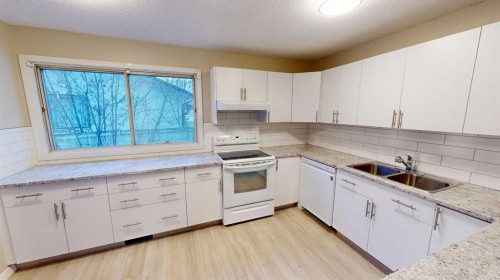 9832 81 Avenue, Grande Prairie, AB - Indoor Photo Showing Kitchen With Double Sink