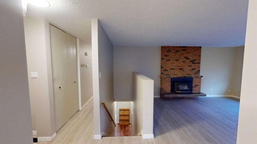 9832 81 Avenue, Grande Prairie, AB - Indoor Photo Showing Other Room With Fireplace