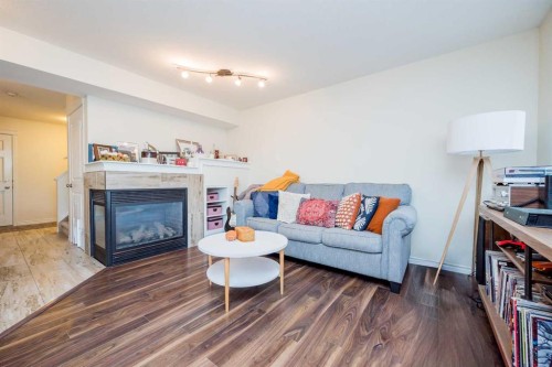 9322 91A Street, Grande Prairie, AB - Indoor Photo Showing Living Room With Fireplace