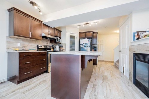 9322 91A Street, Grande Prairie, AB - Indoor Photo Showing Kitchen With Fireplace
