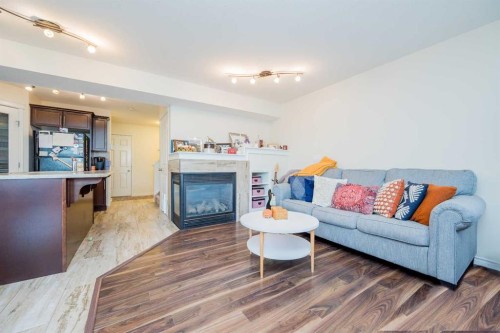 9322 91A Street, Grande Prairie, AB - Indoor Photo Showing Living Room With Fireplace