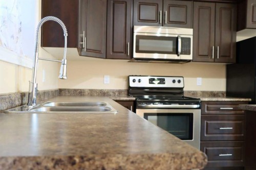 5202 52A Avenue, Valleyview, AB - Indoor Photo Showing Kitchen With Stainless Steel Kitchen With Double Sink