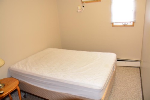 101-215-10118 100 Avenue, Peace River, AB - Indoor Photo Showing Bedroom