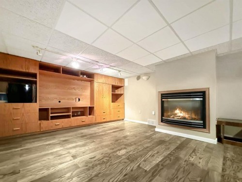 10530 98Th Avenue, Grande Cache, AB - Indoor Photo Showing Living Room With Fireplace