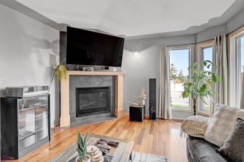 10659 81 Avenue, Grande Prairie, AB - Indoor Photo Showing Living Room With Fireplace