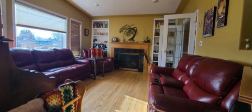 4601 50 Avenue, Grimshaw, AB - Indoor Photo Showing Living Room With Fireplace