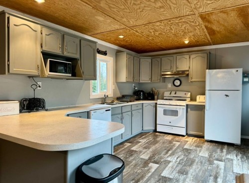 125 Monias Drive, Rural Big Lakes County, AB - Indoor Photo Showing Kitchen With Double Sink