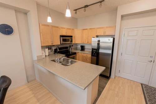 404-12310 102 Street, Grande Prairie, AB - Indoor Photo Showing Kitchen With Double Sink