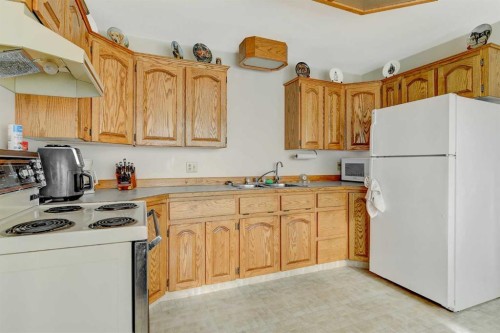 103 11A Street, Beaverlodge, AB - Indoor Photo Showing Kitchen With Double Sink
